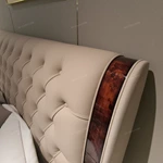 Diamond-Tufted Leather Bed with Curved High-Gloss Wood Side Borders